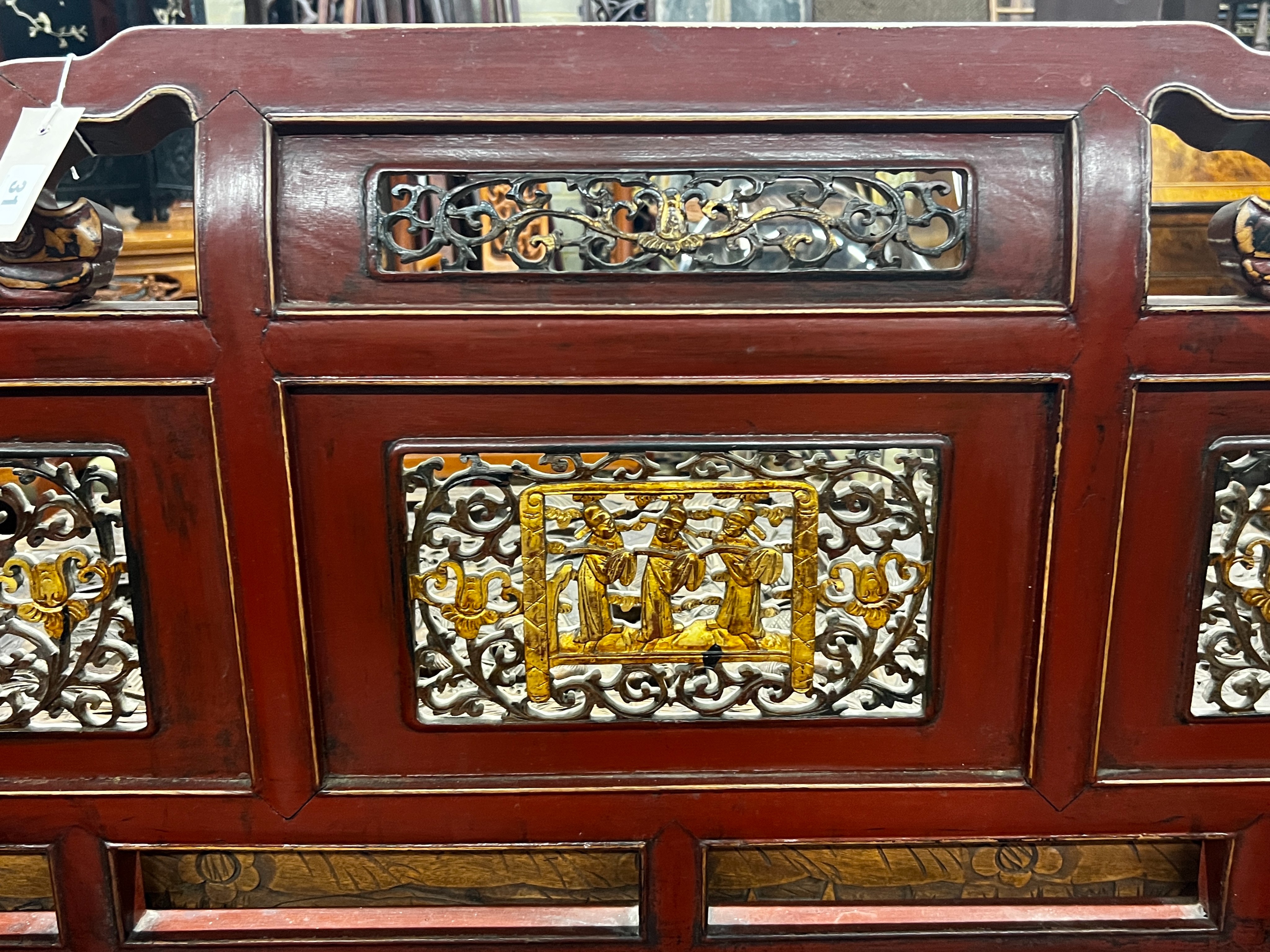 A Chinese scarlet lacquer parcel gilt bench, length 125cm, depth 70cm, height 97cm